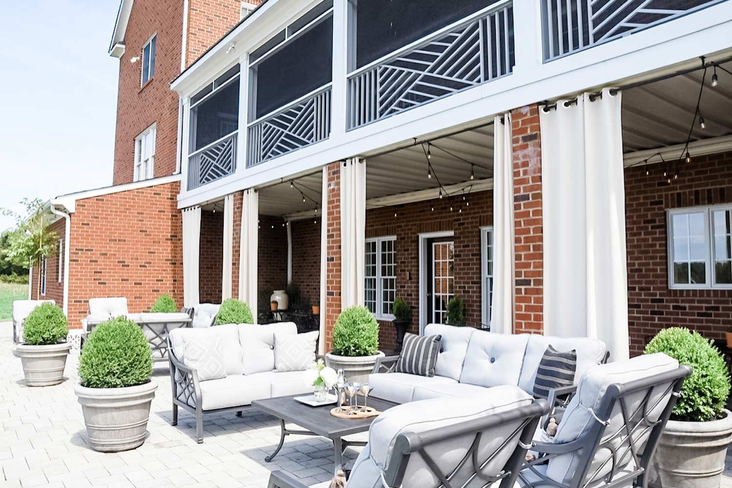 Seating and a dining table on the Manor House patio